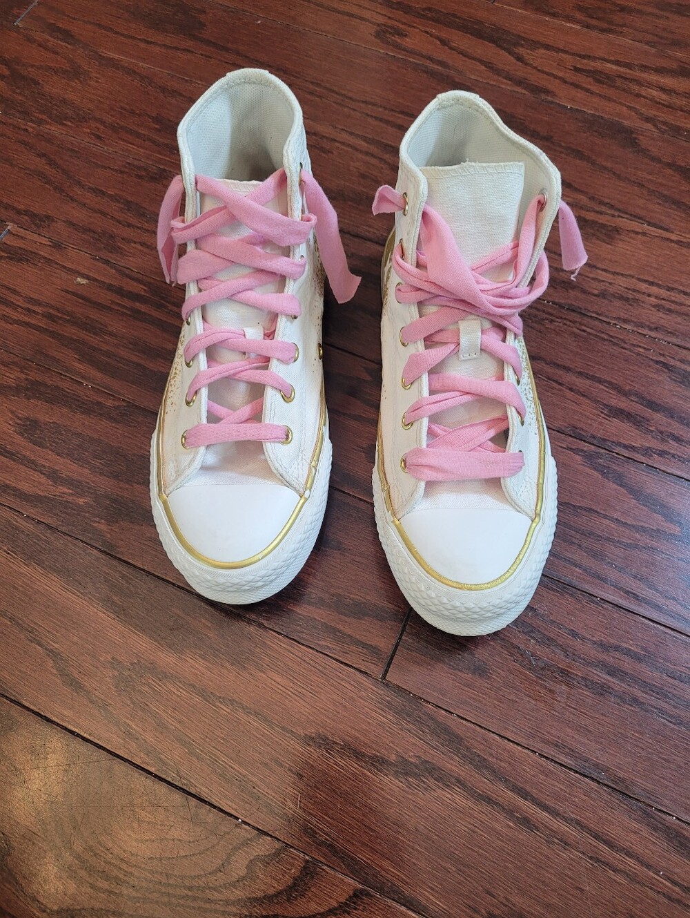 White High-Top Converse Chuck Taylor Sneakers with Pink Laces
